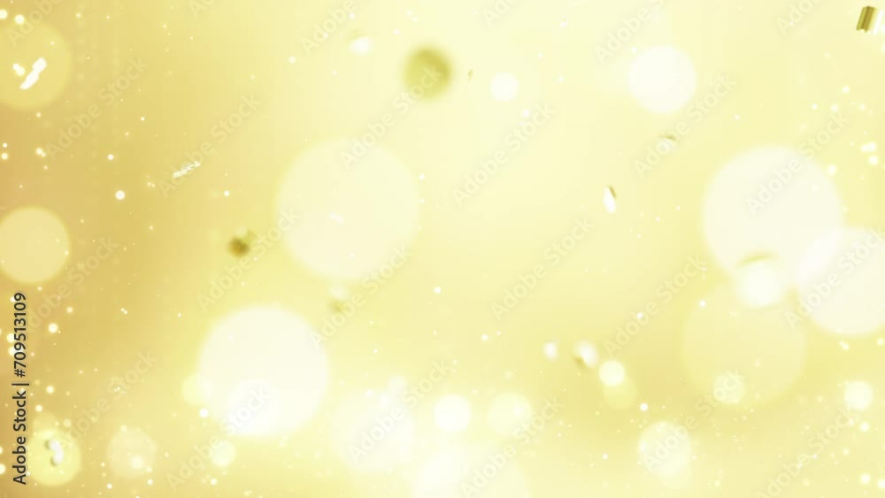 Gold defocused bokeh particles lights shiny smooth motion background. Particles shiny bokeh lights glow moving and flickering luxury background. Gold defocused bokeh particles lights shiny smooth motion background. Particles shiny bokeh lights glow moving and flickering luxury background.