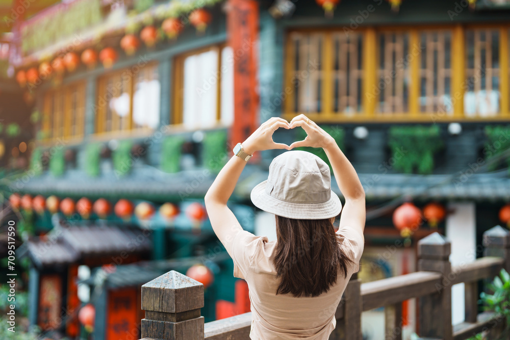 woman traveler visiting in Taiwan, Tourist with hat sightseeing in Jiufen Old Street village with Tea House background. landmark and popular attractions near Taipei city . Travel and Vacation concept - obrazy, fototapety, plakaty 
