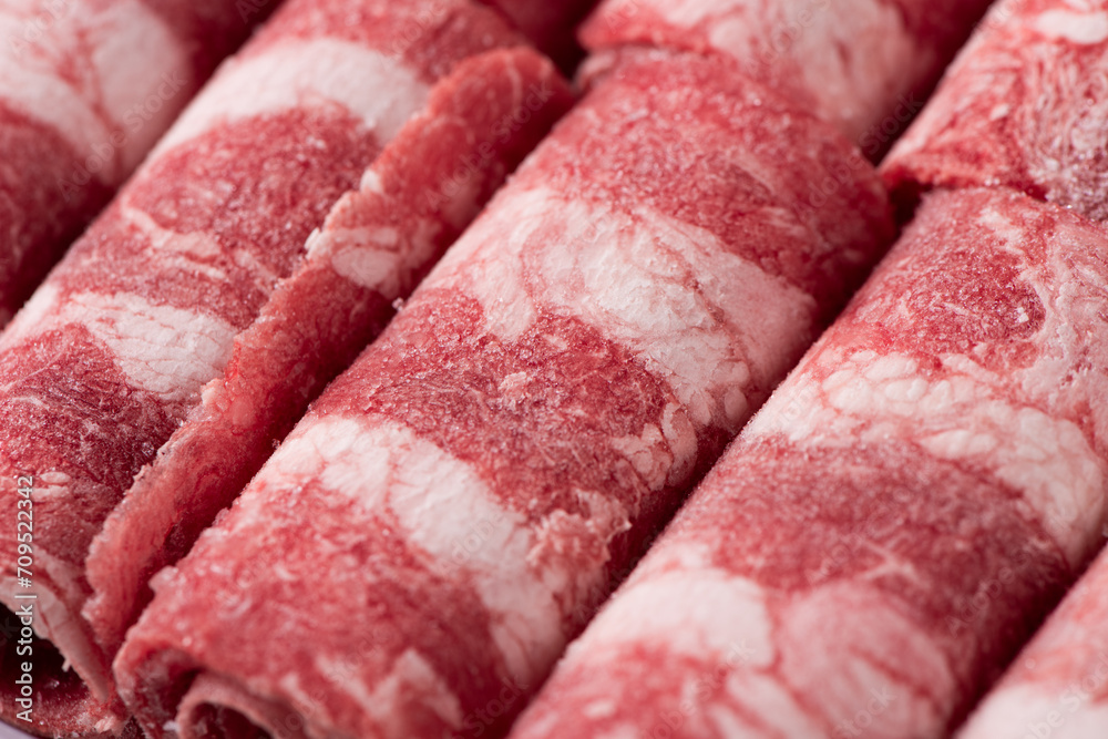 Slice of the fresh raw beef or Beef rolls for shabu Slice of the fresh raw beef or Beef rolls for shabu