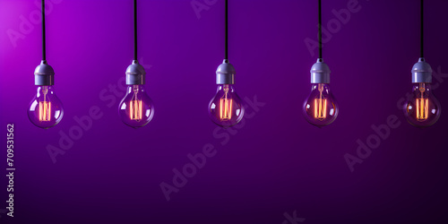Open light bulb on black background purple color