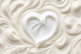 Whipped cream heart on white background.