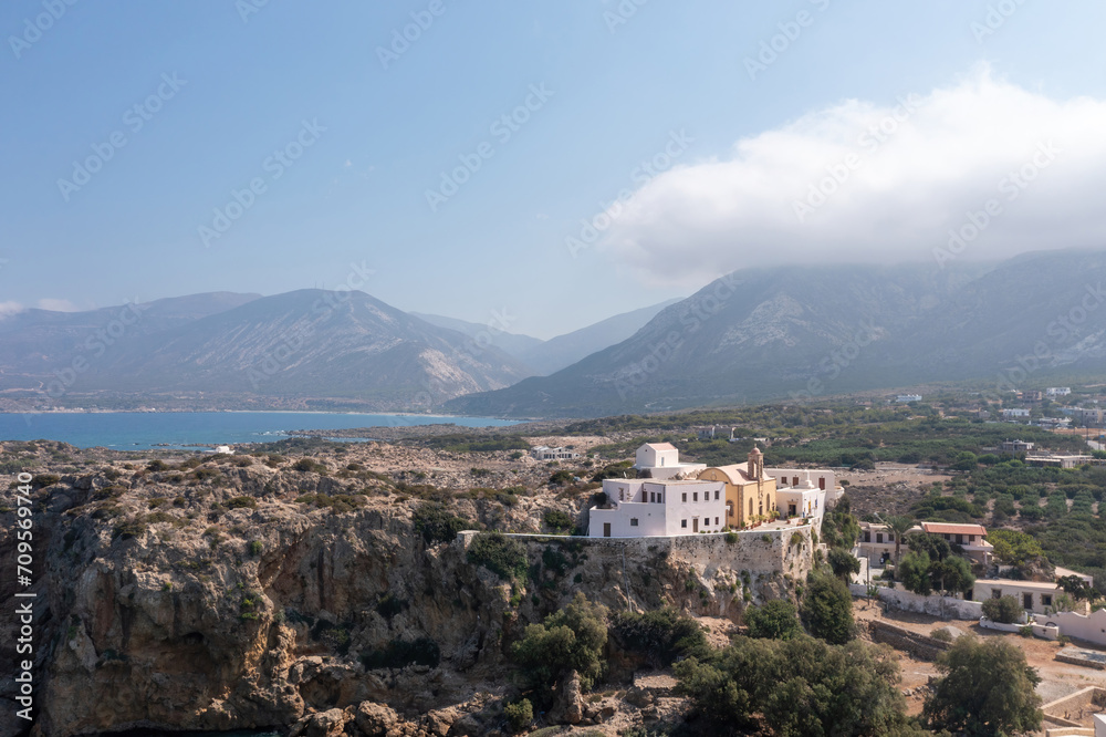 Chania town Crete island, Greece, Chrysoskalitissa Monastery built up on rock. Aerial drone view.