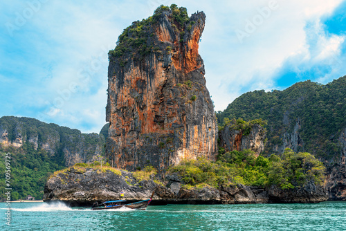 The Ao Nang tower, a solitary sea stack between Ao Nang beach and Rai Leh in the Krabi province This crag is only accessible by water so a long-tail boat ride, kayak or paddleboard is required photo