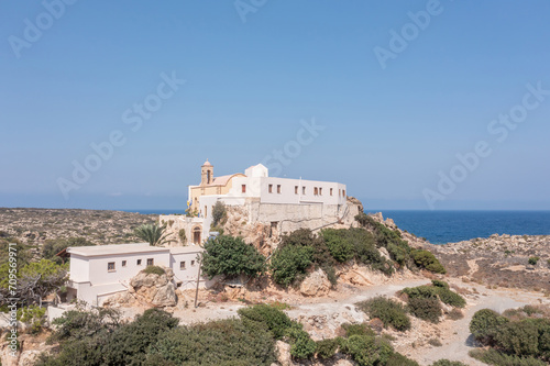 Chrysoskalitissa Monastery built up on rock, Chania town Creete island, Greeece. Aerial drone view.