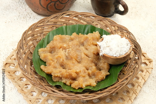 Tiwul is Indonesian traditional food that made ​​from processed cassava and palm sugar, serve with grated coconut. photo