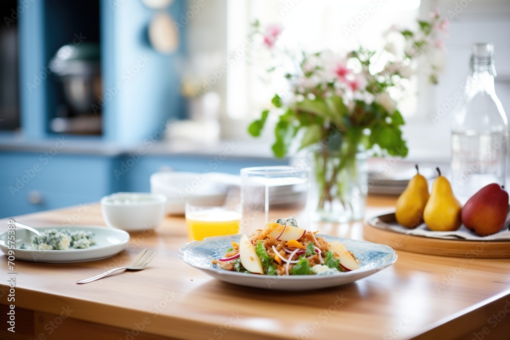 bright kitchen setting with pear and blue cheese salad bright kitchen setting with pear and blue cheese salad