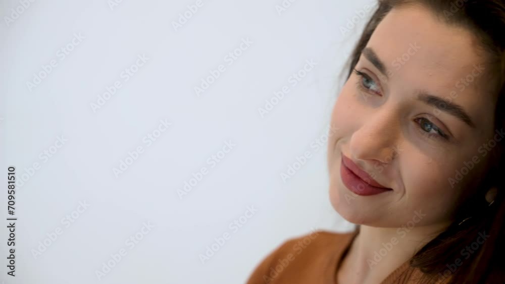 Young woman gently drinking coffee from white cup in medical clinic while waiting for beauty procedures. Beauty epilation cosmetology and spa concept Young woman gently drinking coffee from white cup in medical clinic while waiting for beauty procedures. Beauty epilation cosmetology and spa concept