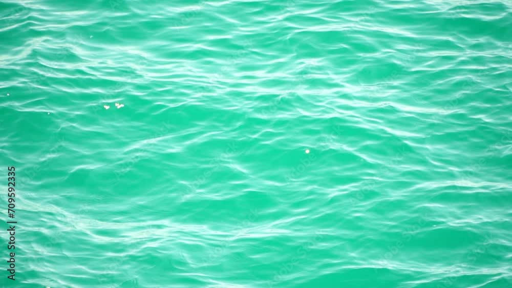 Sea water surface. Camera flies over the calm azure sea. Nobody. Holiday recreation concept. Abstract nautical summer ocean nature. Weather and climate change. Slow motion. Close up Sea water surface. Camera flies over the calm azure sea. Nobody. Holiday recreation concept. Abstract nautical summer ocean nature. Weather and climate change. Slow motion. Close up