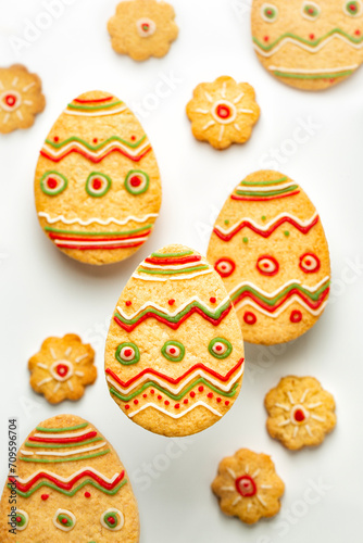 Set of Easter cookies in the form of Eggs, decorated with colored sugar paste. Homemade bakery. Happy easter holiday concept. White background.