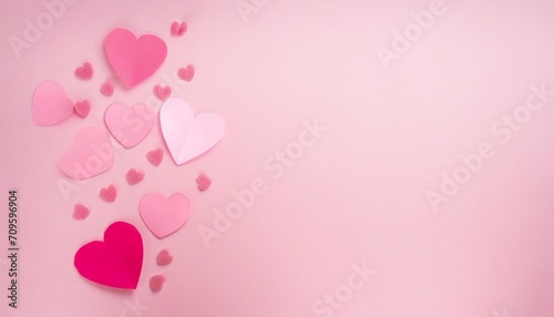 pink valentine card with hearts on a pink background with copy space © Katherine