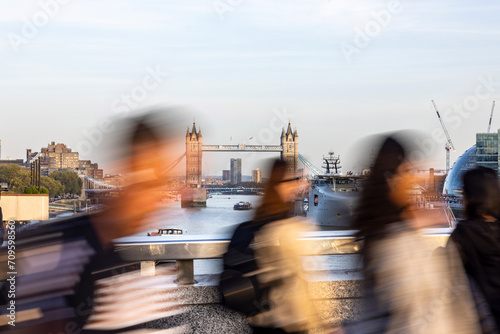 Commuters walking on bridge in London city, UK photo