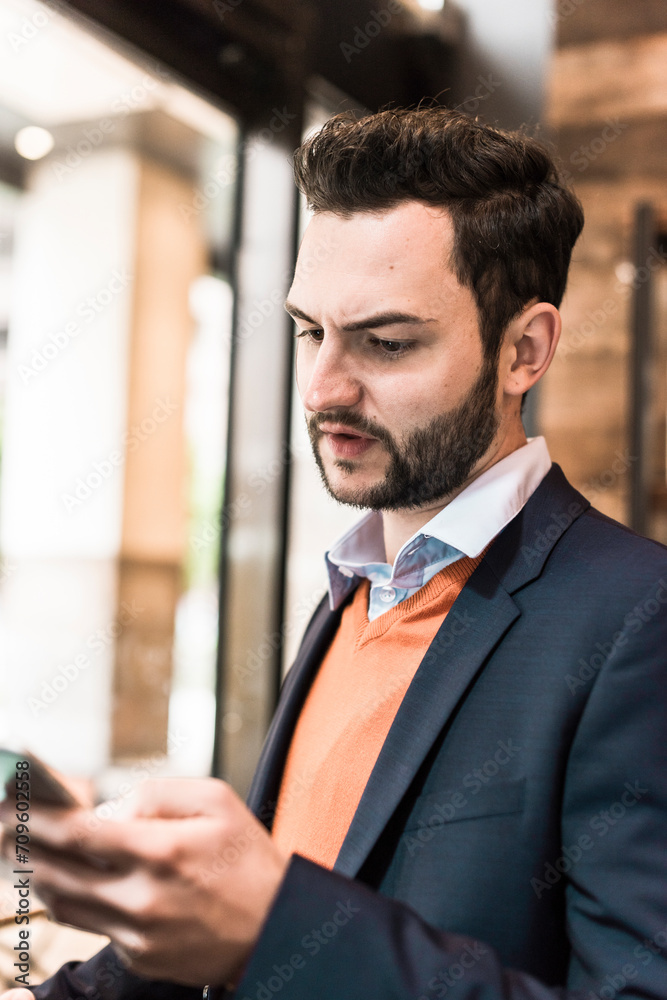 Businessman with beard using smart phone at cafe Businessman with beard using smart phone at cafe