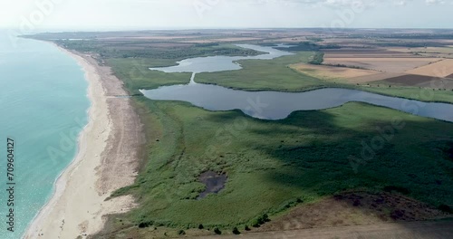 Beautiful landscape of lake, forest, beach and sea. Ezerets and Shabla lakes and Black sea coast in northeast Bulgaria photo