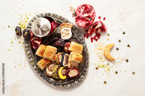 Traditional middle eastern sweets assortment with ramadan decor. Ramadan desserts.