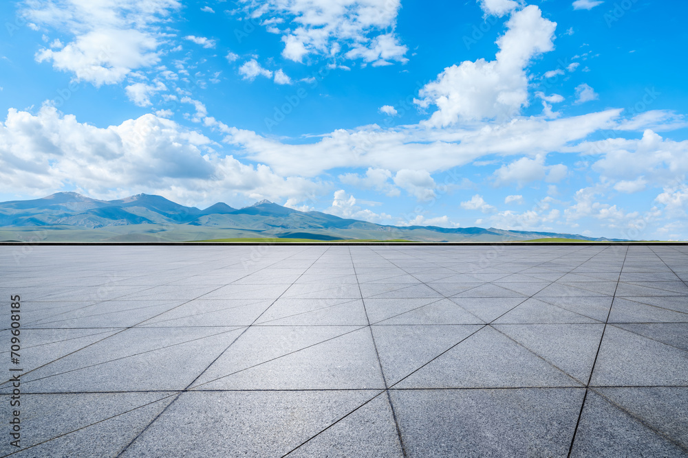 Empty square floor and green mountain nature landscape under blue sky