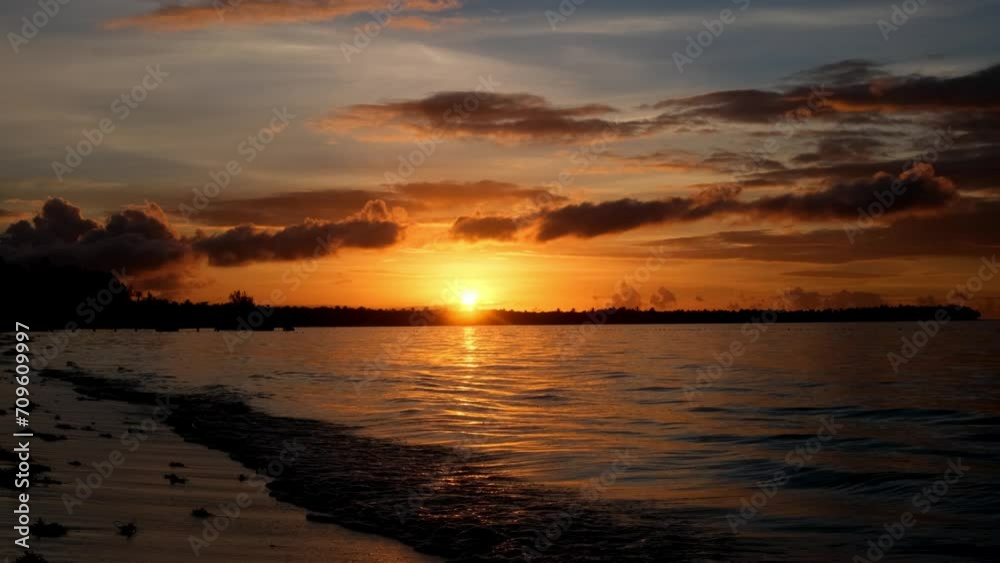 The concept of travel, exotic vacation, and summer sunset. Burning sky and shining golden waves. The concept of travel, exotic vacation, and summer sunset. Burning sky and shining golden waves.