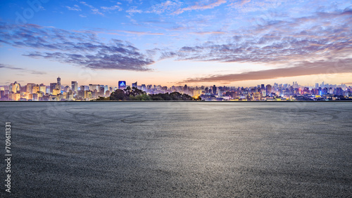 Fototapeta Naklejka Na Ścianę i Meble -  Asphalt road square and city skyline with modern buildings at night. high angle view.