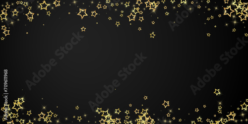 Gold sparkling star confetti.