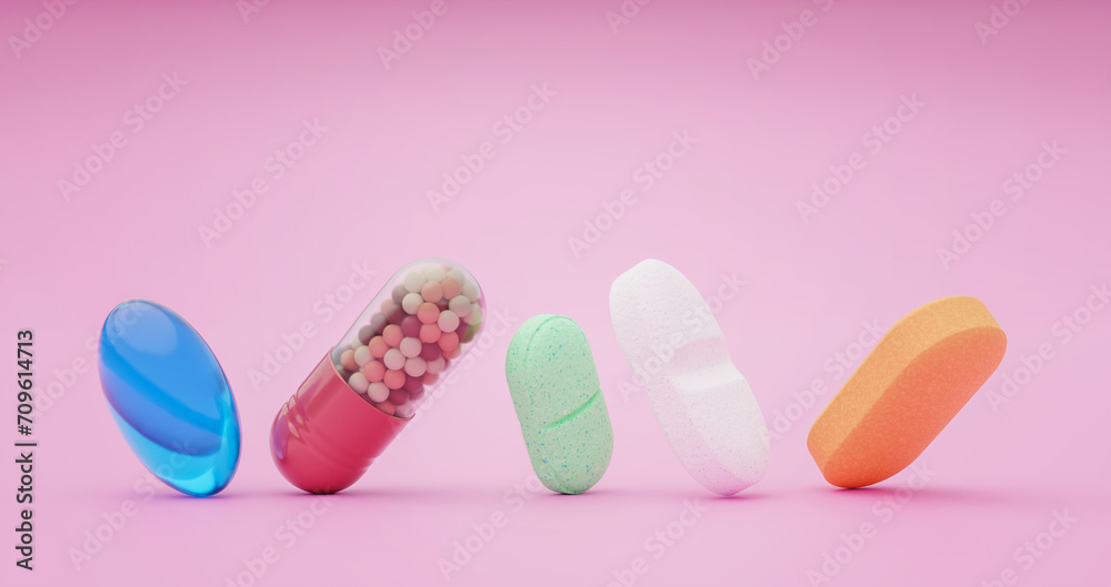Different medications tilted up on pink colored background with space for text. Pharmaceutical prescription concept.