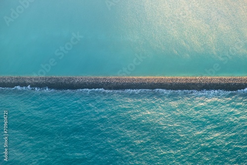 breakwater wall in the sea photo