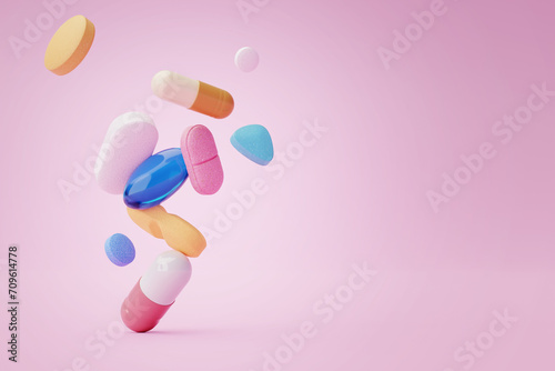 Pile of different and colorful medications falling on pink background with space for text. Disease cure and prevention.