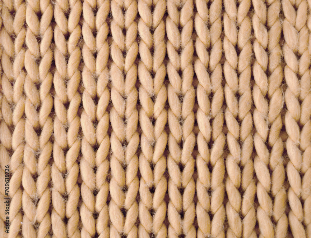 Knitting, sample from beige yarn. Synthetic fibers. Knitting, sample from beige yarn. Synthetic fibers.