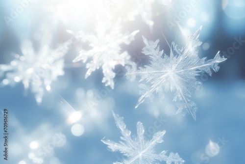  a close up of a snowflake on a blue background with a blurry image of snow flakes.