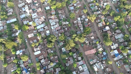 In this brief 4K aerial clip, a bird's eye view captures the simplicity and charm of a rural township outside Pretoria, South Africa. Small houses dot the landscape.