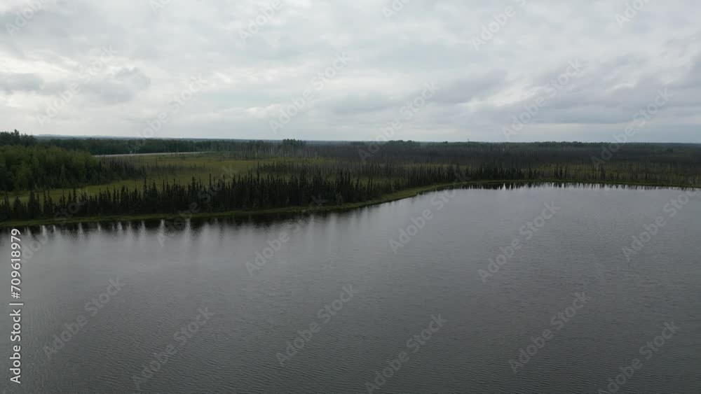 Lake in Alaska. Surrounded by Trees Lake in Alaska. Surrounded by Trees