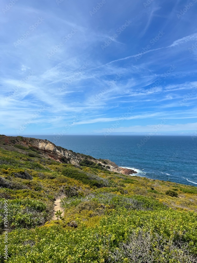 Beautiful rocky ocean coast, blue ocean horizon, natural ocean view