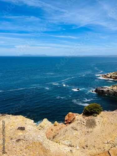 Beautiful rocky ocean coast, blue ocean horizon, natural ocean view