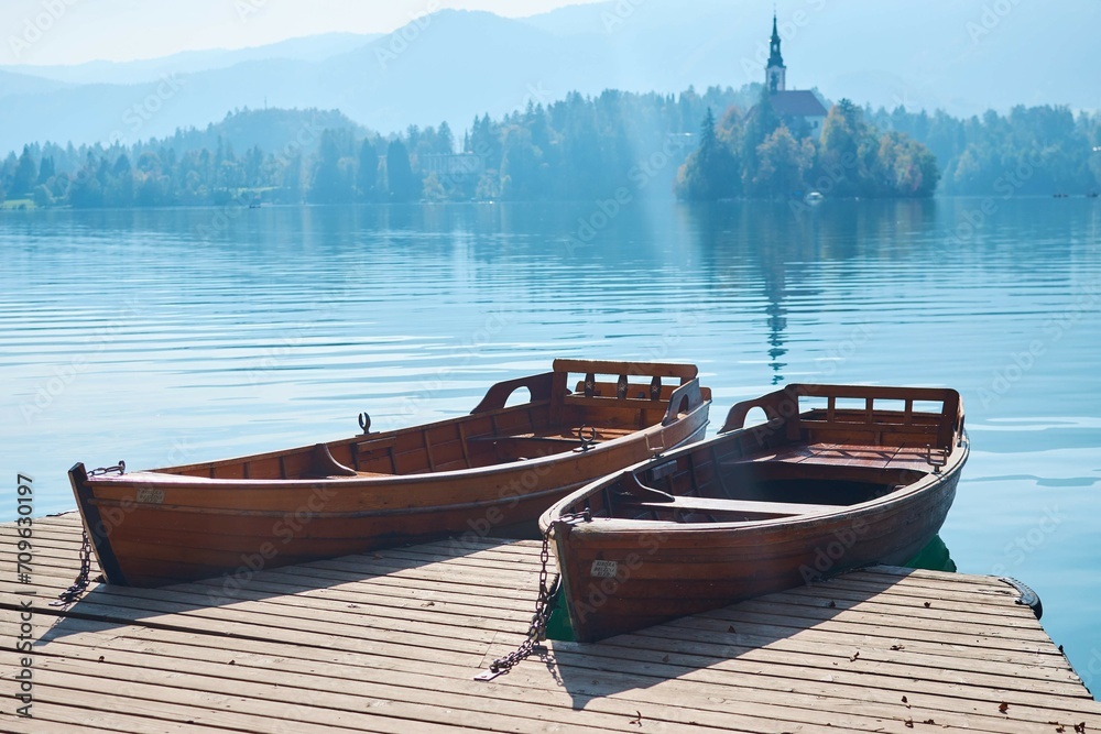 lake bled , view on island with a church and boats