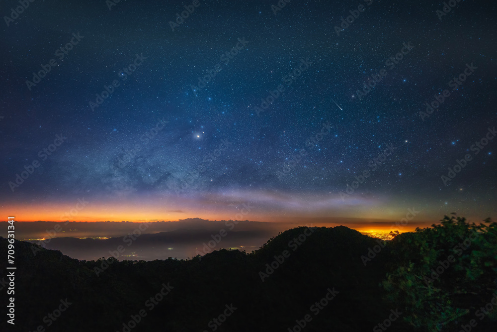 Milky way over locating on mountain view between the hiking route to Chiang Dao Wildlife Sanctuary. Chiang Mai province in Thailand.