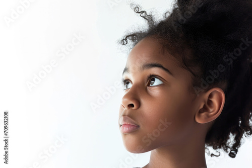 Closeup Portrait Of Stunning African American Teen Girl, Gazing Ahead, In Child Ad With White Background And Space For Copy