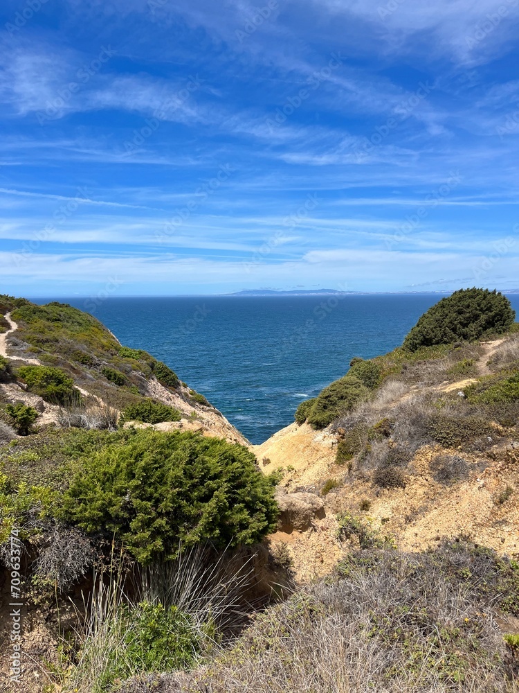 Beautiful rocky ocean coast, blue ocean horizon, natural ocean view