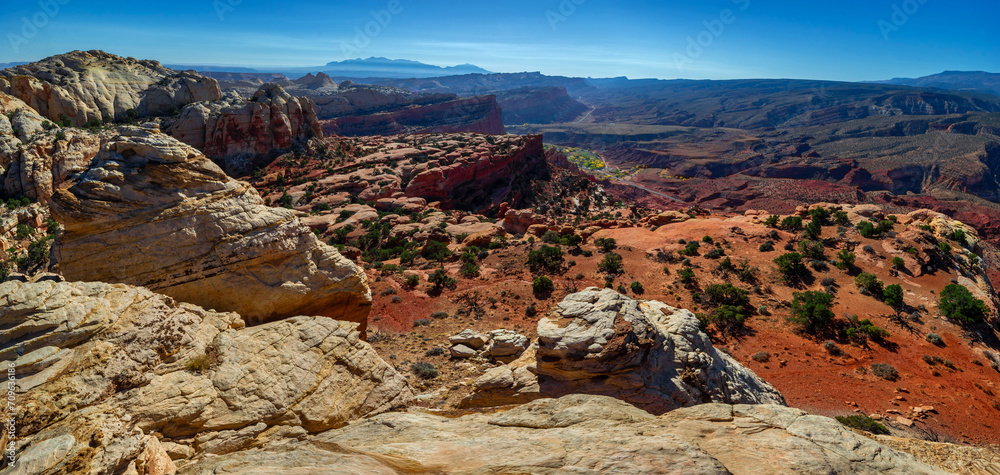 Sandstone formations in an arid canyon landscape panorama