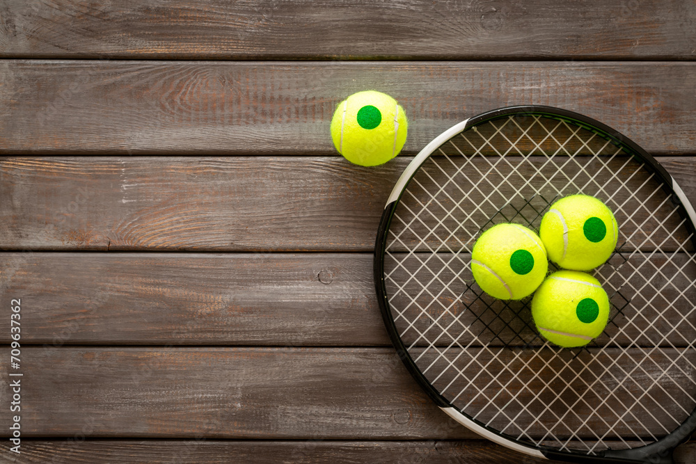 Tennis racquet and balls, top view. Sport games background