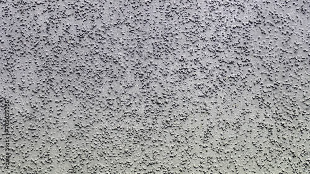 Concrete cement particles decor pattern. Abstract gray wall texture. Solid surface background for design. Pattern for design and decoration 4K. Background video. Surface abstract footage.