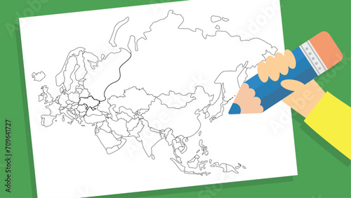 hand holding pencil and drawing a map of the eurasia