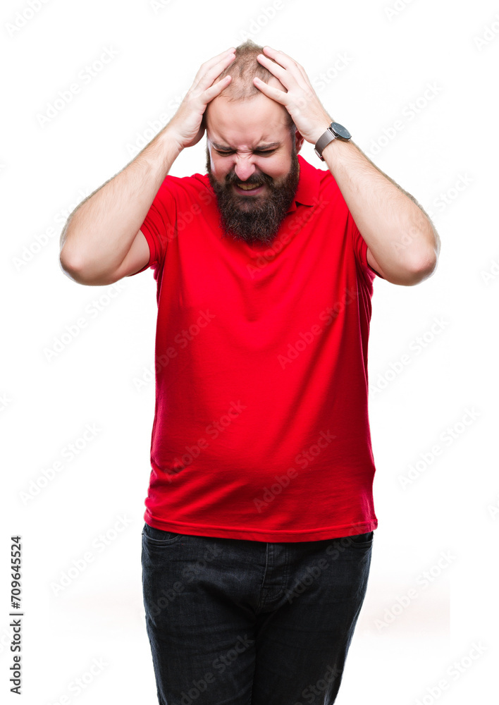 Young caucasian hipster man wearing red shirt over isolated background suffering from headache desperate and stressed because pain and migraine. Hands on head. Young caucasian hipster man wearing red shirt over isolated background suffering from headache desperate and stressed because pain and migraine. Hands on head.