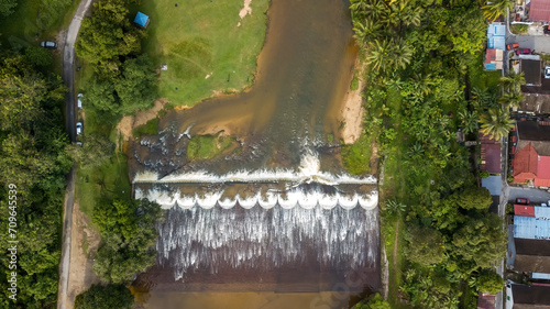 Aerial view of the Water flowing from the stream to the dam in Malaysia. photo