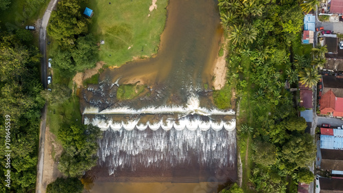 Aerial view of the Water flowing from the stream to the dam in Malaysia.