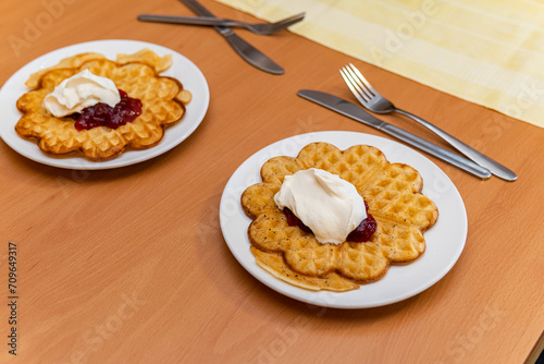 Swedish waffles with berry jam and whipped cream