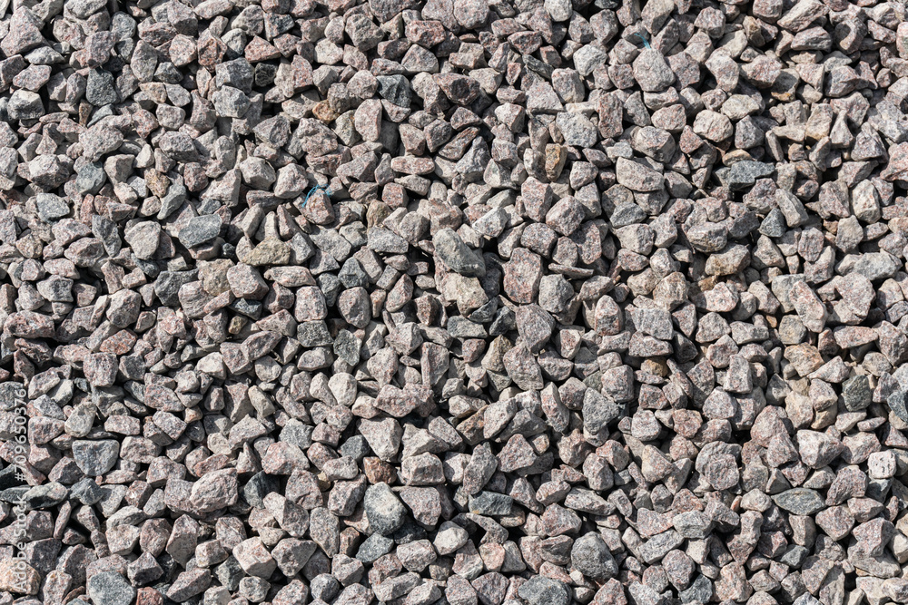 A big pile of stones on the ground outdoors