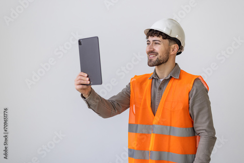 Portrait of ma? architect with tablet computer on white background