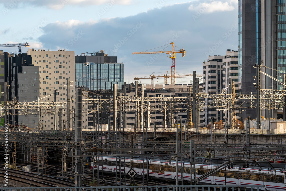 Elevated view of train tracks with a background of apartment and office buildings in the Atocha area in the city of Madrid in Spain Elevated view of train tracks with a background of apartment and office buildings in the Atocha area in the city of Madrid in Spain