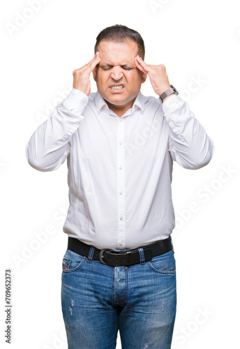 Middle age arab elegant man over isolated background with hand on head for pain in head because stress. Suffering migraine.