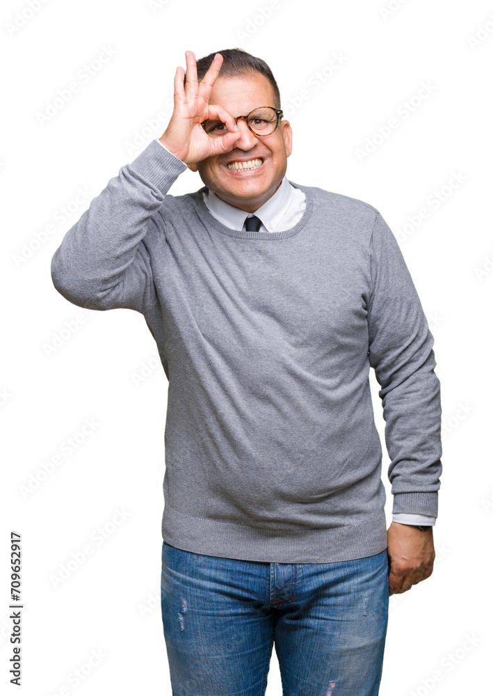 Middle age bussines arab man wearing glasses over isolated background doing ok gesture with hand smiling, eye looking through fingers with happy face. Middle age bussines arab man wearing glasses over isolated background doing ok gesture with hand smiling, eye looking through fingers with happy face.