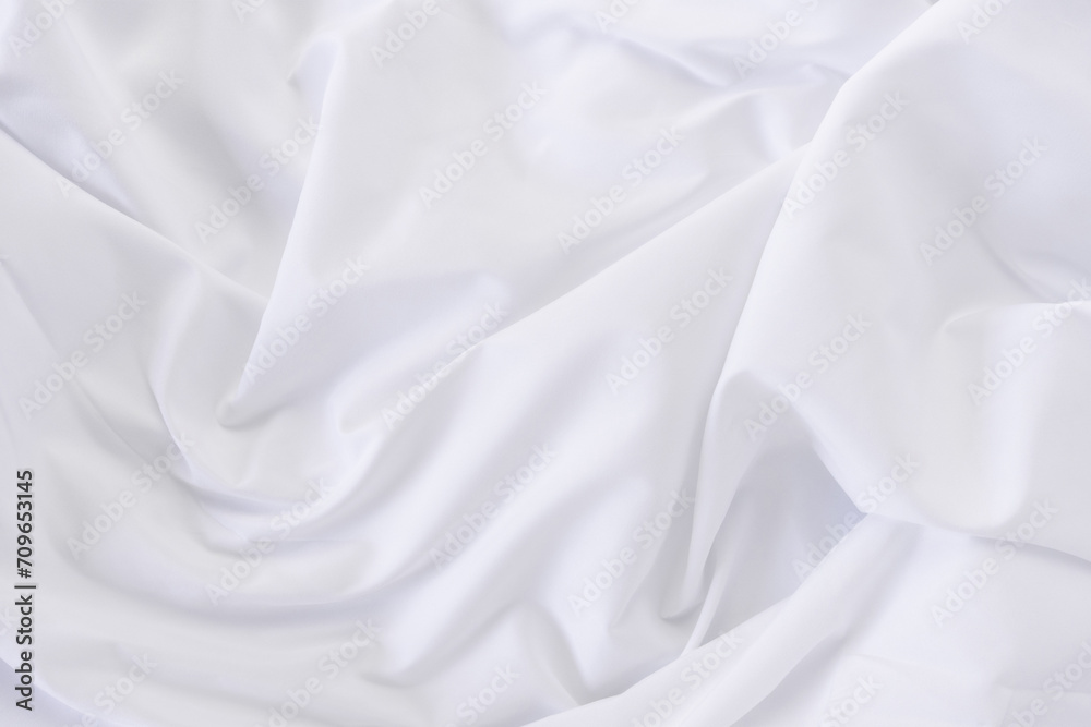 Obraz premium White fabric. luxurious white fabric texture background. Creases of satin, silk and cotton.