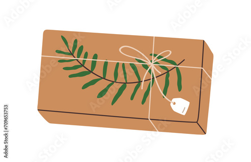 Gift box in kraft paper wrapping. Present design with leaf plant, branch deco...